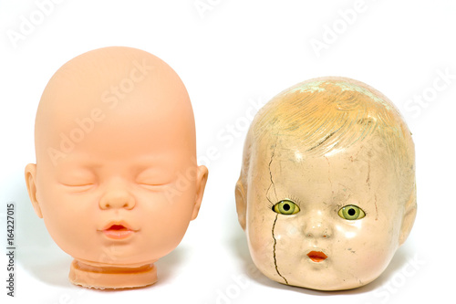 Fotografia, Obraz Contrasting baby doll heads: sweet and creepy.