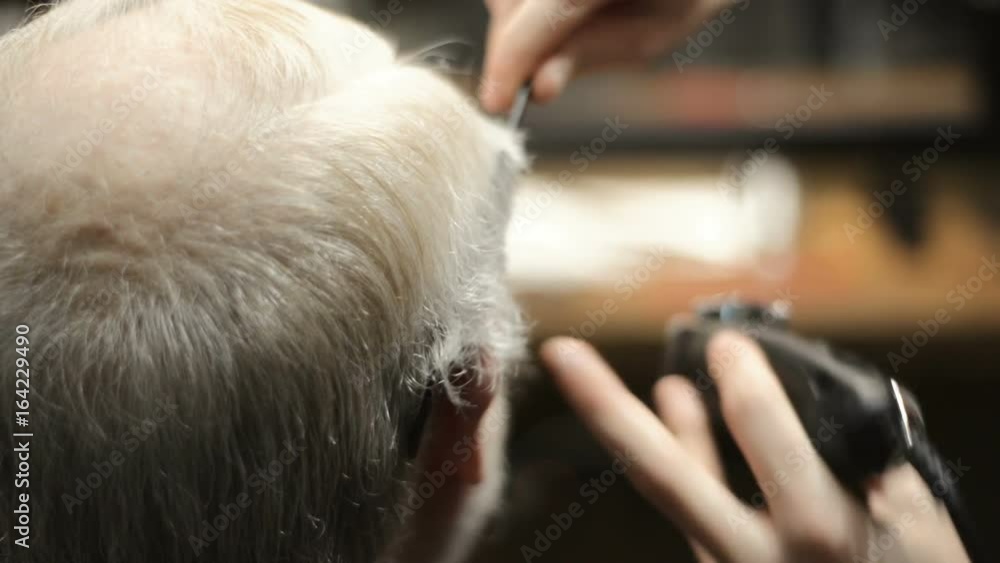 Active retired elderly old bearded senior man aged with graying hair in barber shop hairstylist hairstyle getting Haircut and shaving , head, beard and mustache Active retired elderly old bearded senior man aged with graying hair in barber shop hairstylist hairstyle getting Haircut and shaving , head, beard and mustache