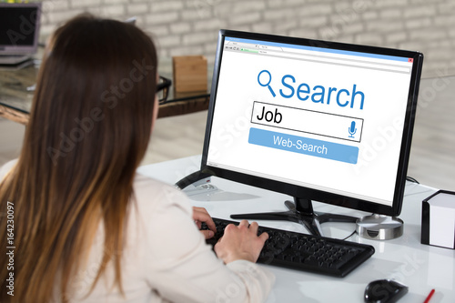 Businesswoman Searching Online Job In Office