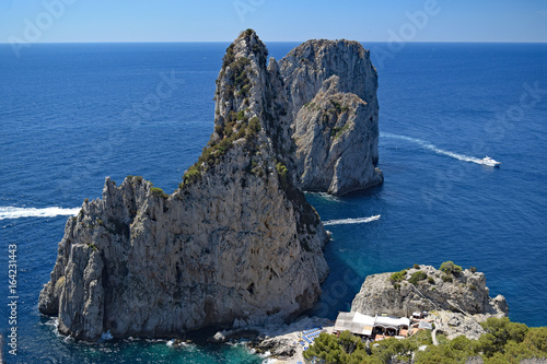 Faraglioni, the Three Rocks of Capri, seen from the Pizzolungo trail, Capri, Italy photo