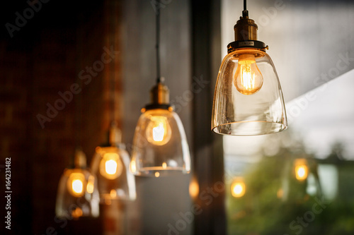 Classic glass pendants with incandescent bulb photo