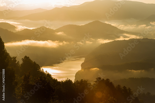 Sun burning off the fog over Great Smoky Mountains National Park © Lamar