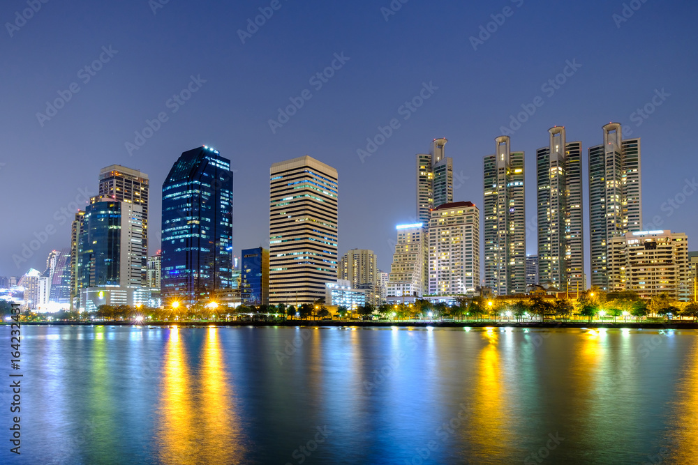 Asoke modern buildings of Bangkok night city skyline, Thailand.
