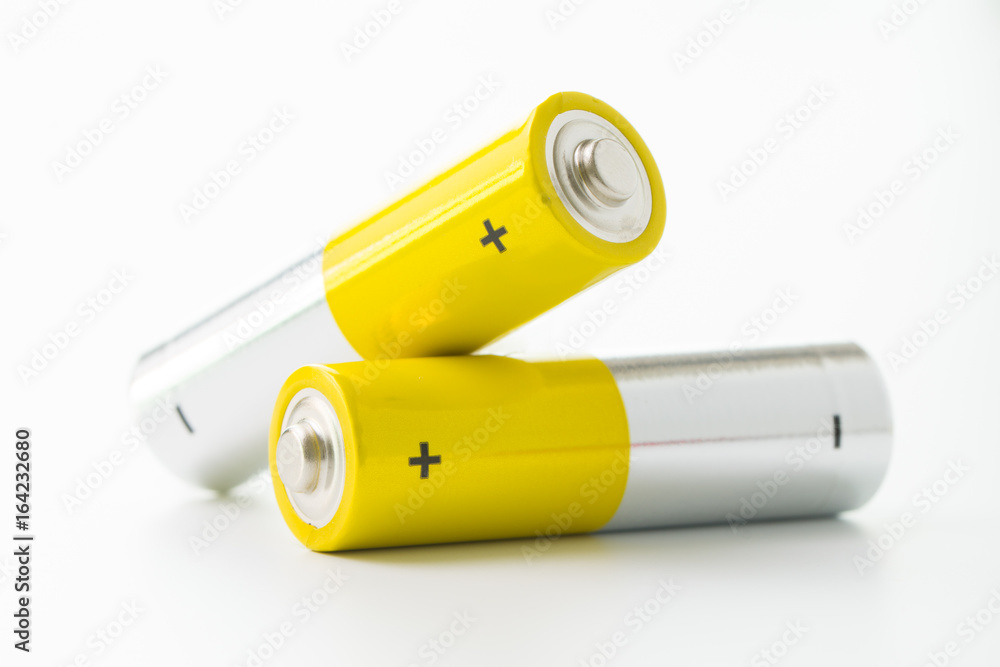 Yellow alkaline batteries - obrazy, fototapety, plakaty 