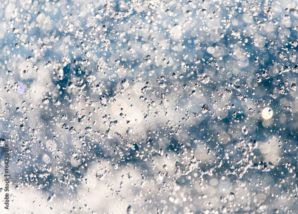 Obraz premium Abstract background of drops of water on the fly