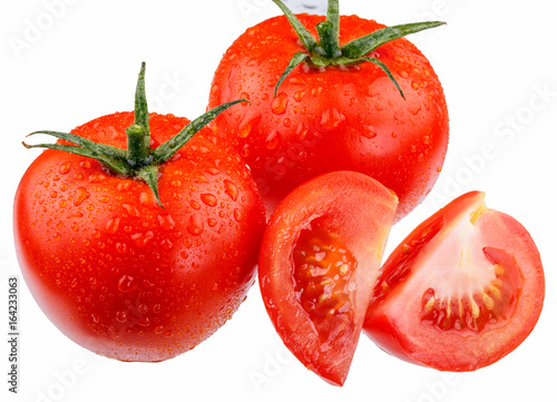Tomatoes and tomato slices in drops of water on a white background