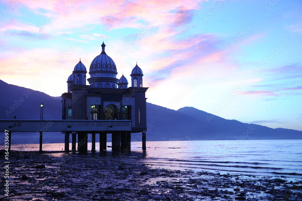 Fototapeta premium INDONESIA, JAN 8, 2017 : Beautiful sunrise of Masjid Terapung (Mosque) in Palu, Indonesia