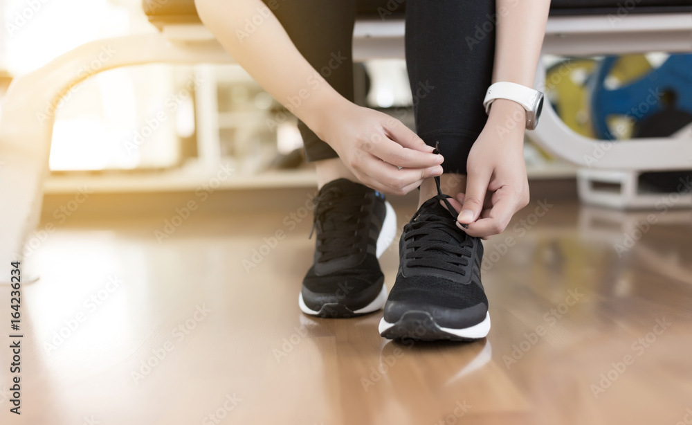 Female fitness exercise concept Fit woman stretching her leg to warm up Happy young fitness woman Female fitness exercise concept Fit woman stretching her leg to warm up Happy young fitness woman
