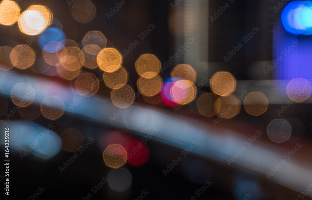Abstract bright multicolored lights against city skyline. Abstract bright multicolored lights against city skyline.