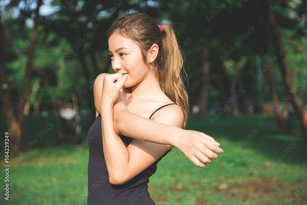 Young asian lady stretching Young asian lady stretching