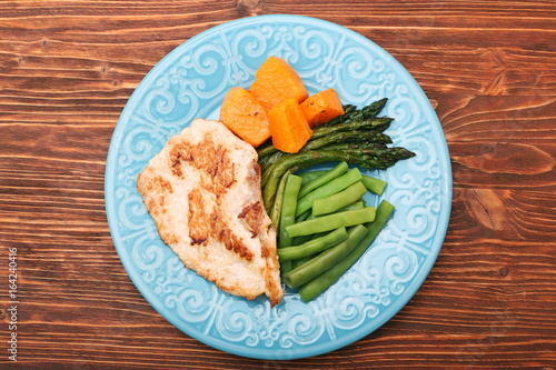 Roast turkey fillet with asparagus pumpkin and green beans