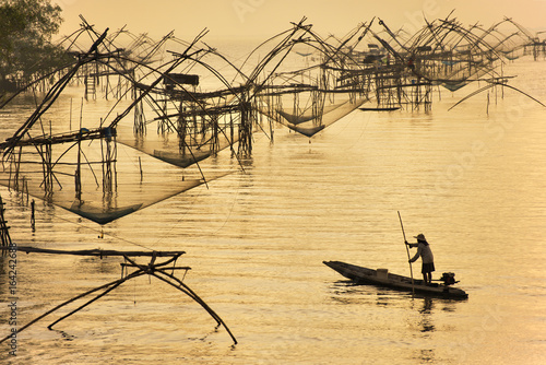 Fisherman and Big Fishing Net at Phatthalung, Thailand photo