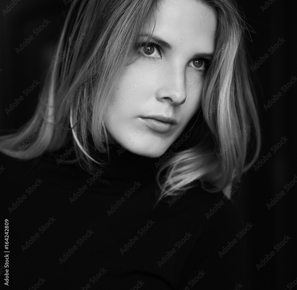Black and white portrait of beautiful young woman. Selective soft focus.