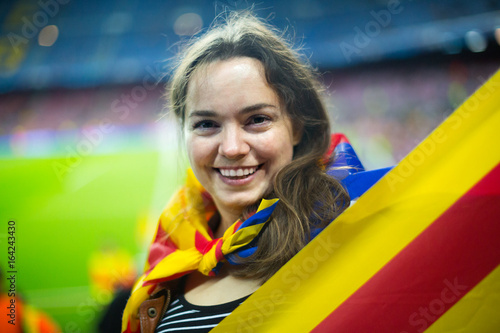 Female football fan with flag