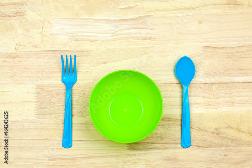 Colorful plastic bowl and Cutlery for a children photo