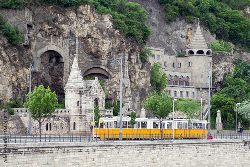 Yellow tram and Gellert hill caves in Budapest, Hungary