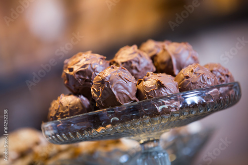 Delicious confectionary covered with milky chocolate icing at cafe display
