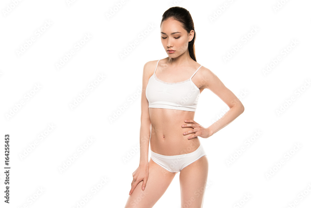 slim attractive asian woman posing in white underwear, isolated on white slim attractive asian woman posing in white underwear, isolated on white