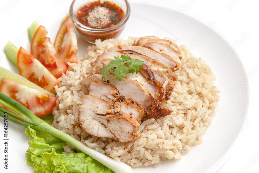 Brown rice with roasted chicken served with thai style chili sauce and vegetables
