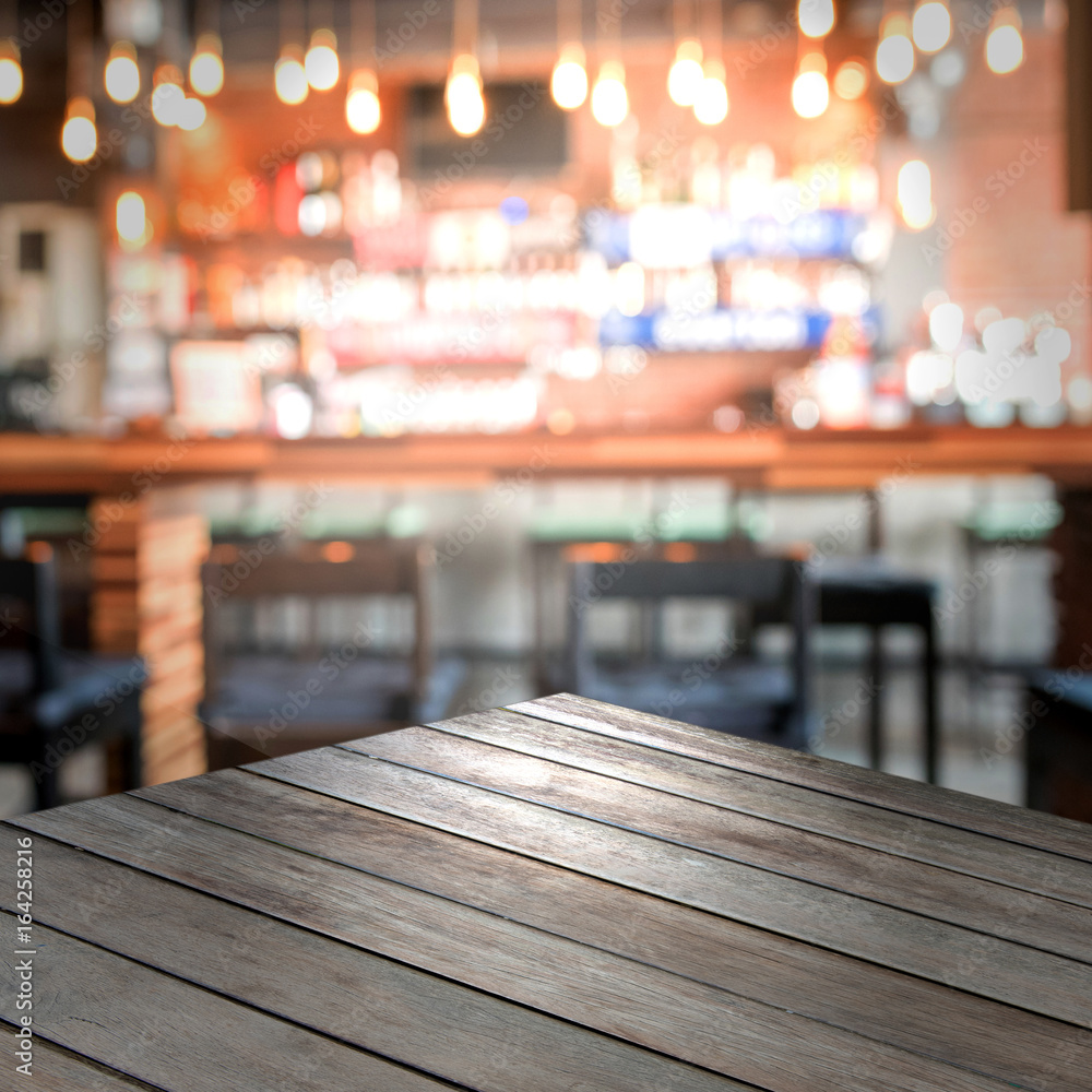 Empty wood top table with space for display product in Blurred cafe background. Empty wood top table with space for display product in Blurred cafe background.
