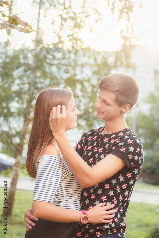 Fototapeta premium boyfriend hugging his girlfriend, and stroking her hair