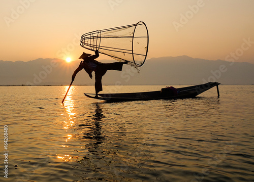 Fisherman catching fish on Inle lake, Myanmar photo