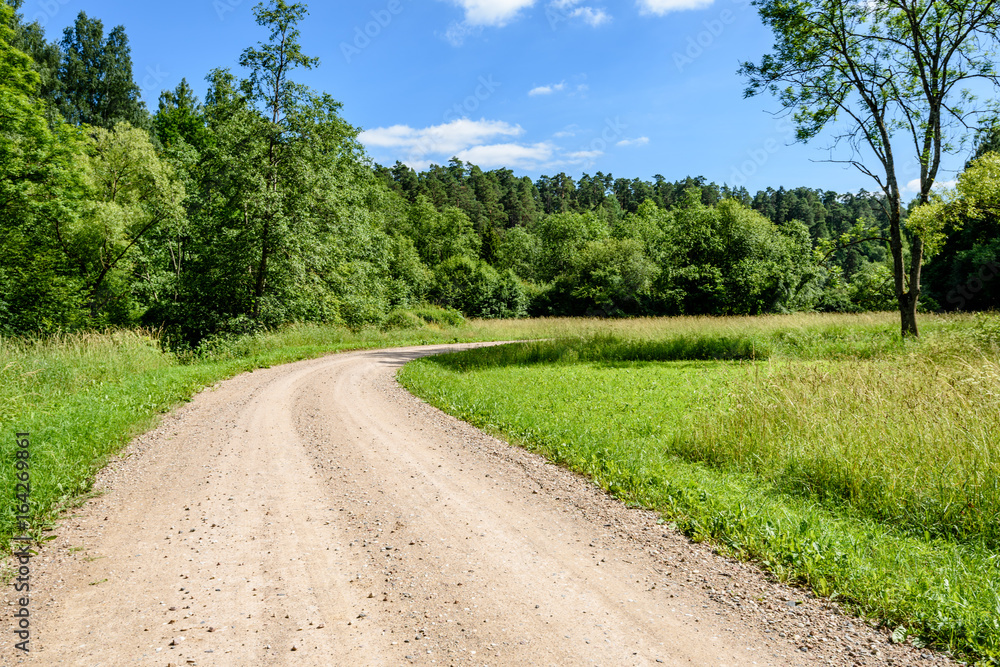 gravel road in summer countryside gravel road in summer countryside