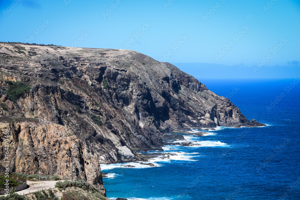 Rocky coastline at Fonte da Areia on the northern coast of Porto Santo Island, Madeira, Portugal