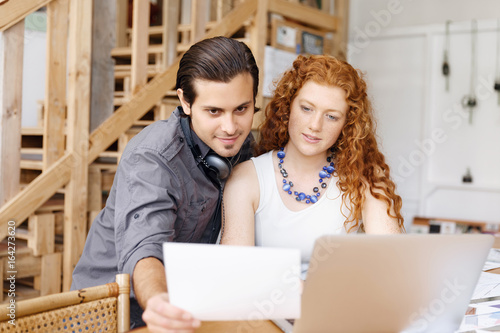 Two young designers in office