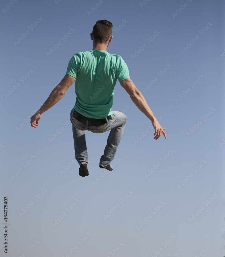 Freedom and imagination. The guy is flying in the air Freedom and imagination. The guy is flying in the air