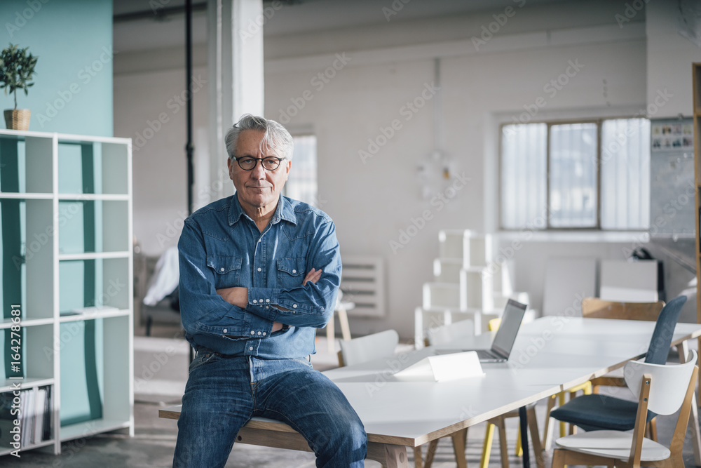 Portrait of confident senior businessman in office Portrait of confident senior businessman in office