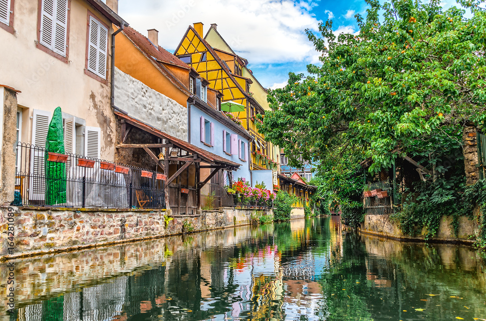 Journey through small river canals and streets in the city of Colmar or small Venice, France