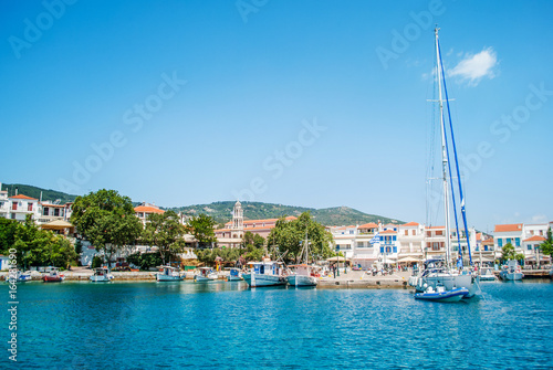 Skiathos, Greece - June 27, 2011: Beautiful turquoise blue sea on the island of Skiathos with boats and yachts in the background
