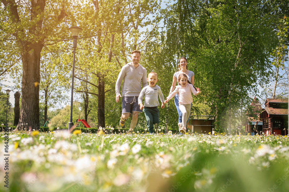Fototapeta premium Cheerful family playing with their children's.