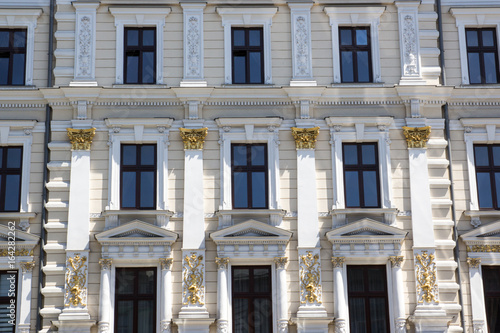 Facade of the old white vintage house photo