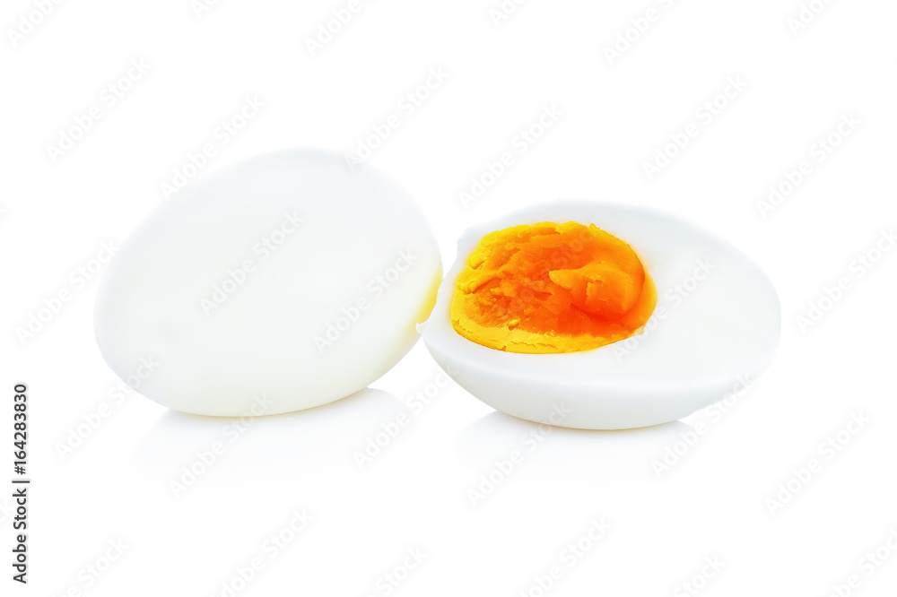 Boiled eggs cut in half isolated on white background. Boiled eggs cut in half isolated on white background.
