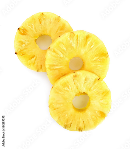 A cut slice of pineapple fruit isolated on white background