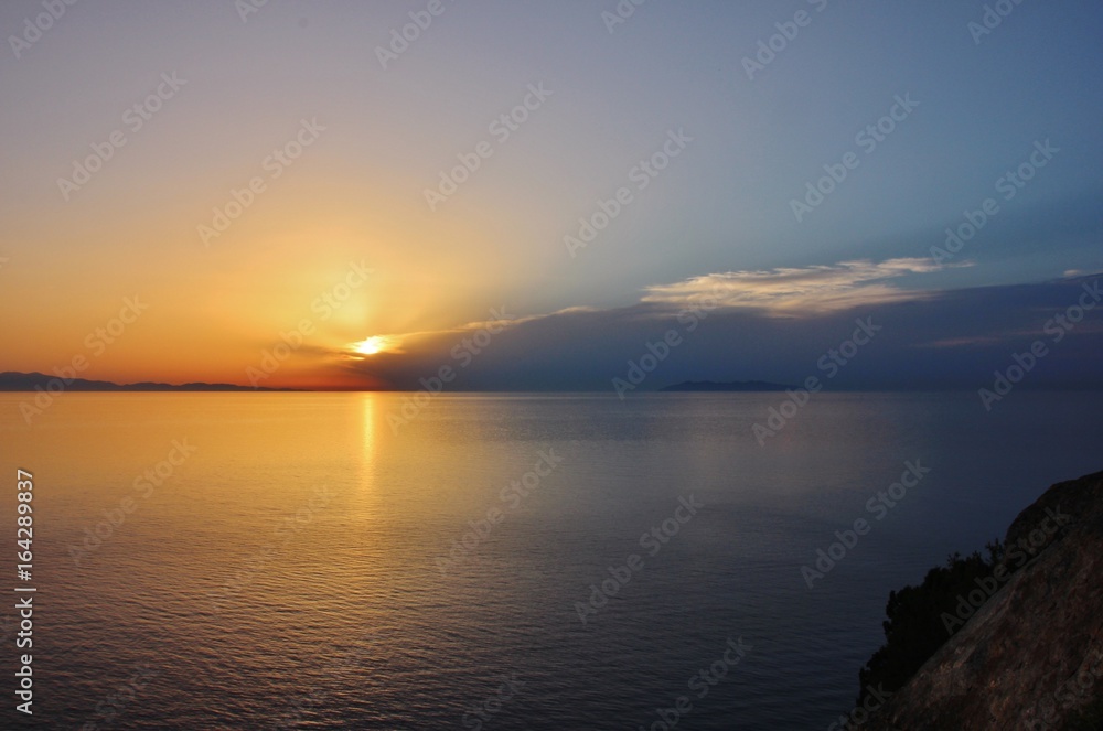 Sunset from Punta Nera, Elba island, over Corsica and Capraia islands 