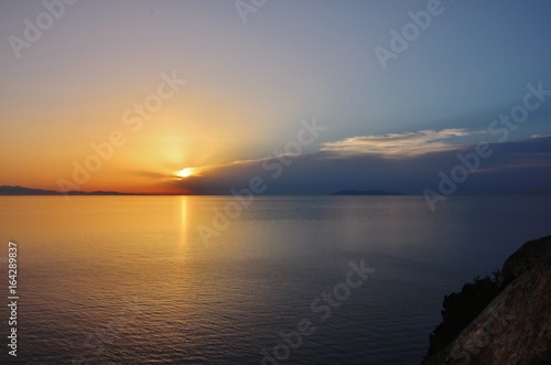 Sunset from Punta Nera, Elba island, over Corsica and Capraia islands 