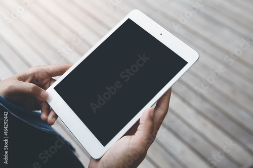 close-up hand hold digital tablet blank screen