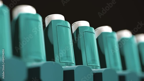 Looping pan over and endless line of blue asthma inhalers.