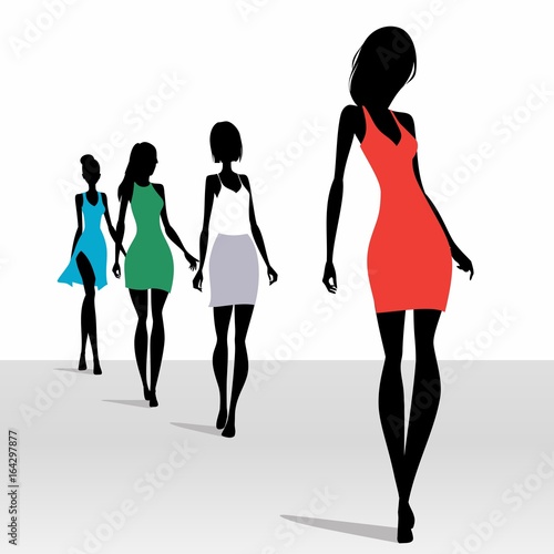 Model silhouettes walking on the podium