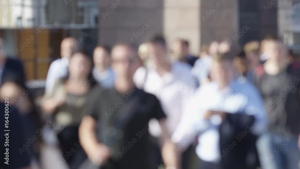 Blurred background of morning commuters on their way to work, in slow motion - great for text Blurred background of morning commuters on their way to work, in slow motion - great for text