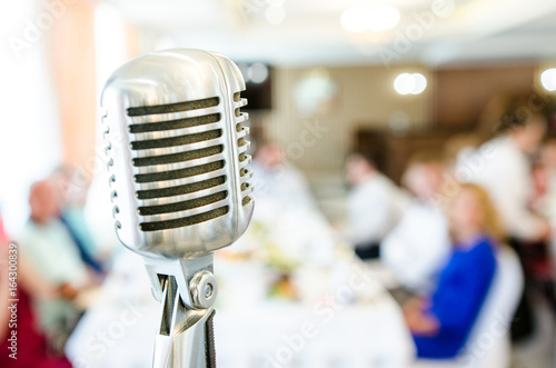Retro microphone on light background