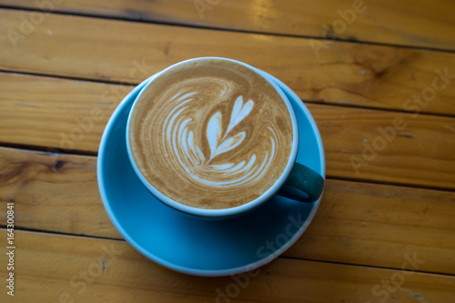 coffee latte art on wood table