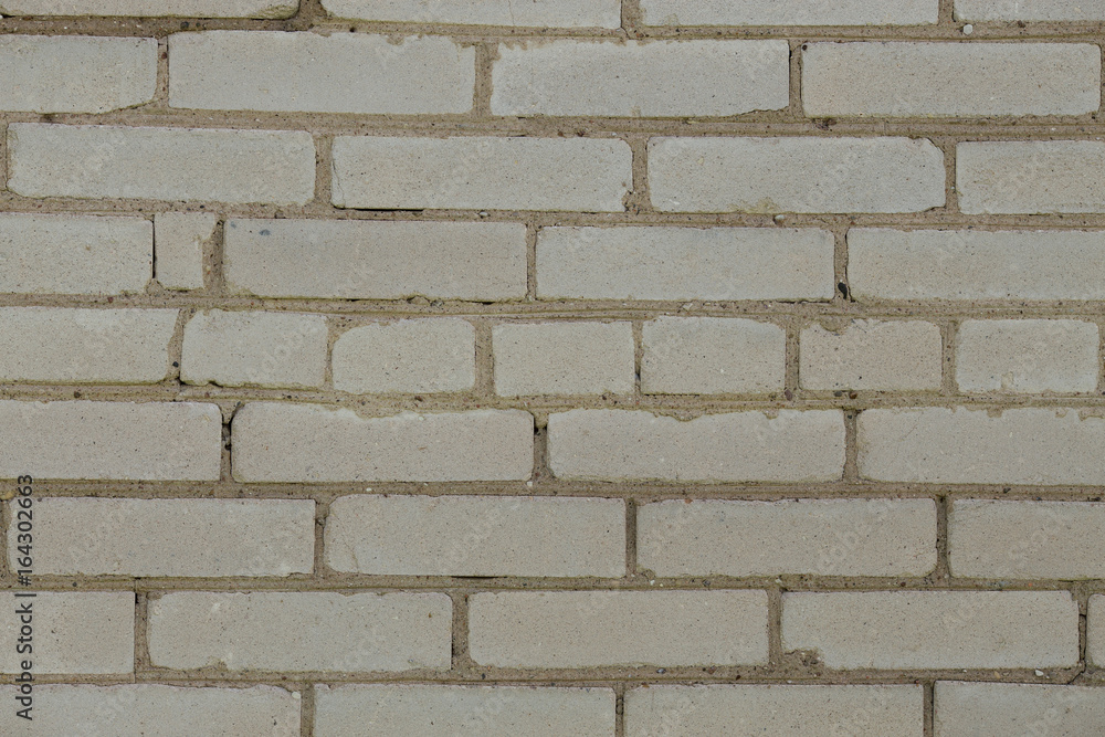 Obraz premium Background of the white brick wall with horizontal masonry
