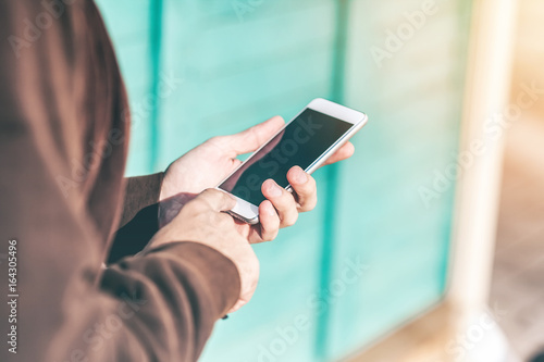 Close up of Man's hands with Smartphone