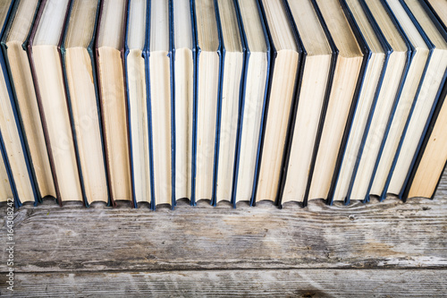 Stack of books on a blue background.