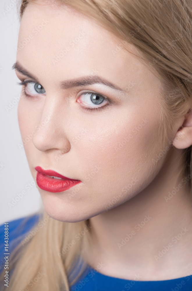Girl with red lips and professional makeup on adorable face Girl with red lips and professional makeup on adorable face