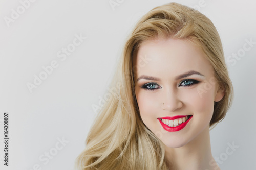 Happy woman smiling with red lips